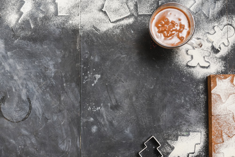 juice with ice in glass near wooden board