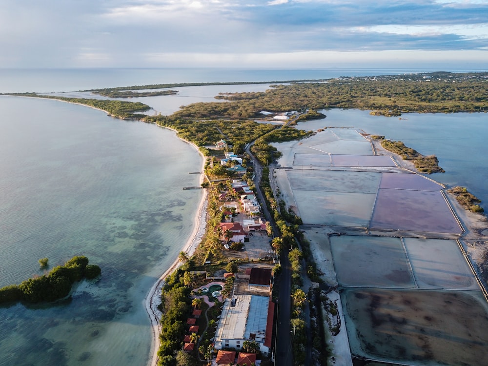 aerial photography of houses and building near blue sea under white and blue sky