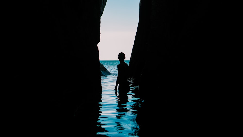 person standing on body of water