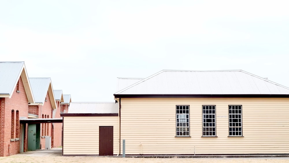 beige and pink houses during daytime