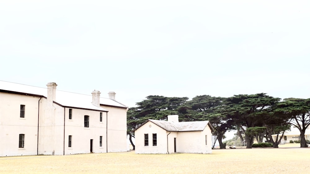 white concrete building near green trees during daytime