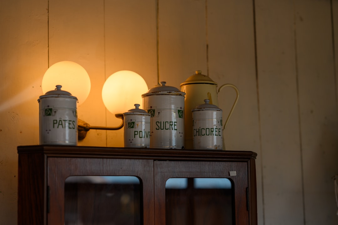 white canister set on brown wooden cabinet