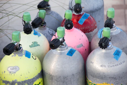 Air tanks neatly arranged on store shelves.