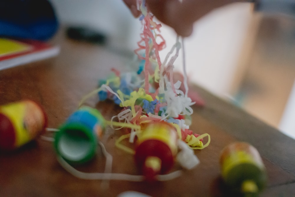 selective focus photography of assorted-color bands on table