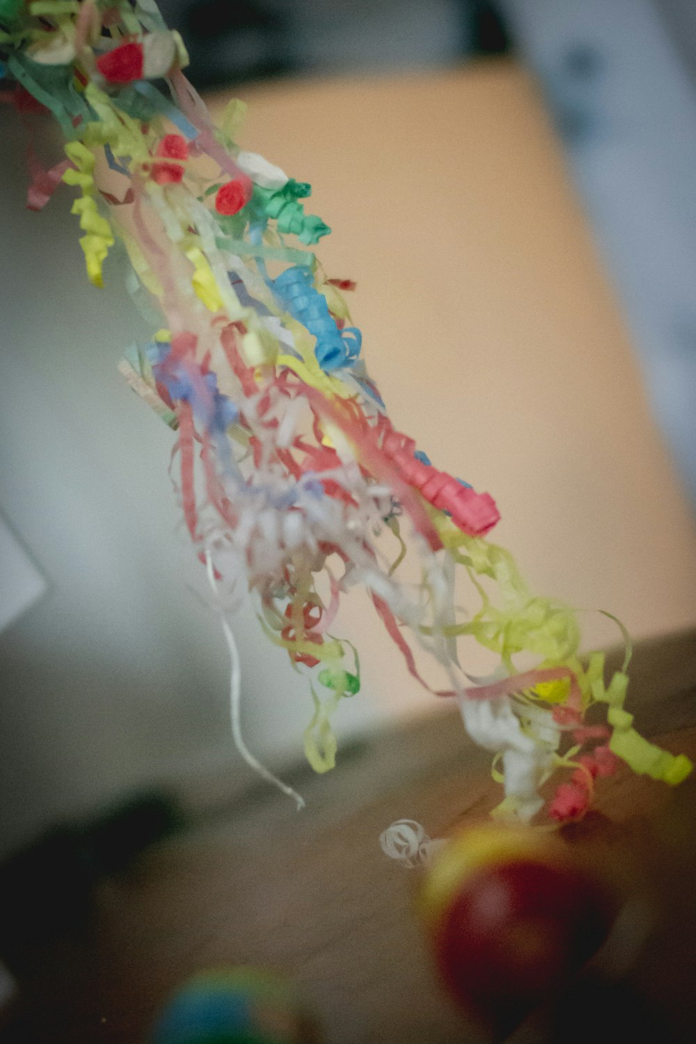 a string of colorful streamers hanging from a ceiling