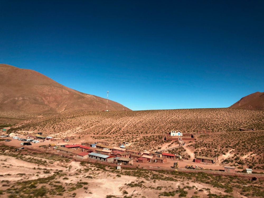 buildings on desert under blue sky