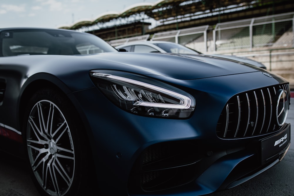 selective focus photography of parked black Mercedes-Benz coupe during daytime