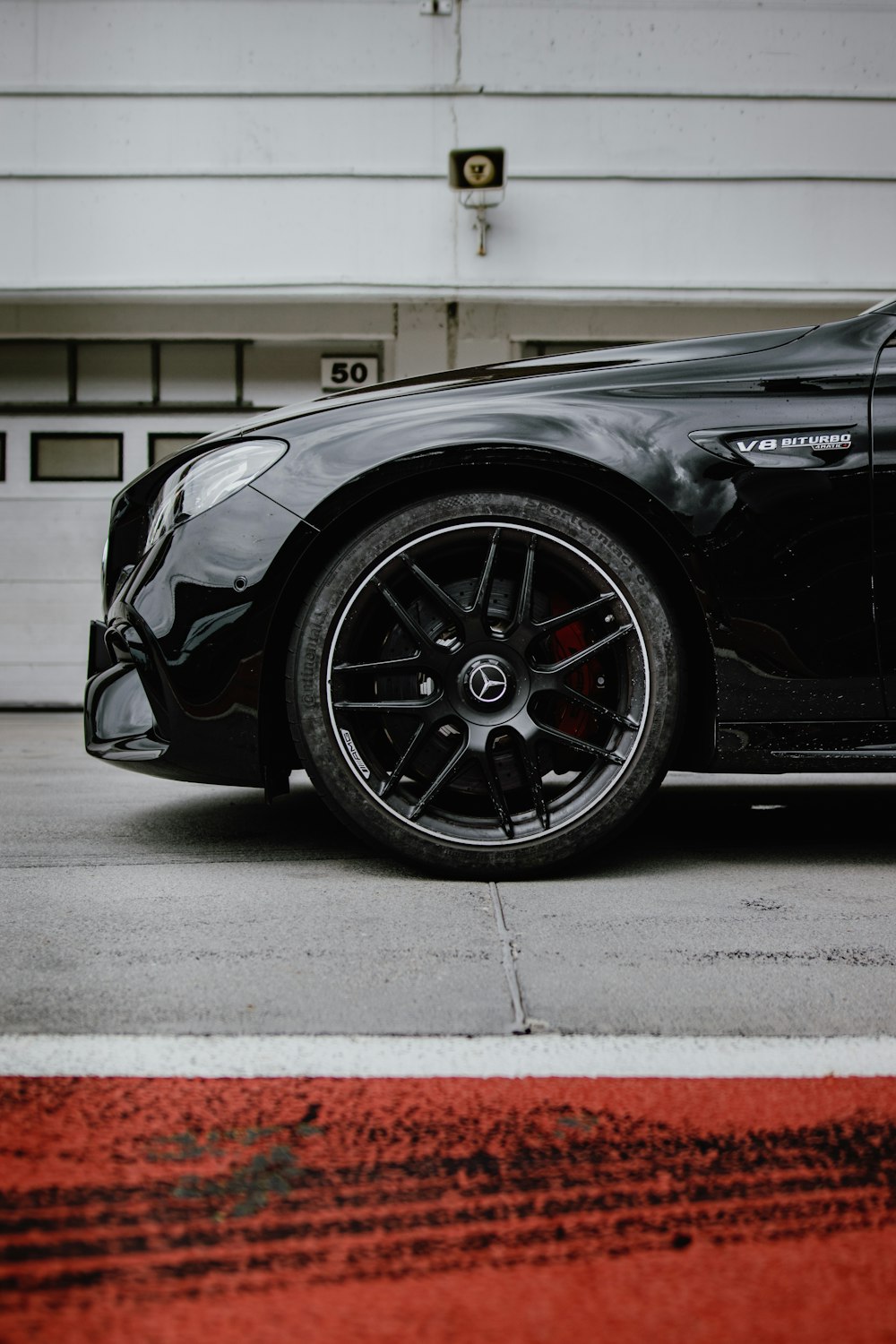 selective focus photography of parked black car during daytime