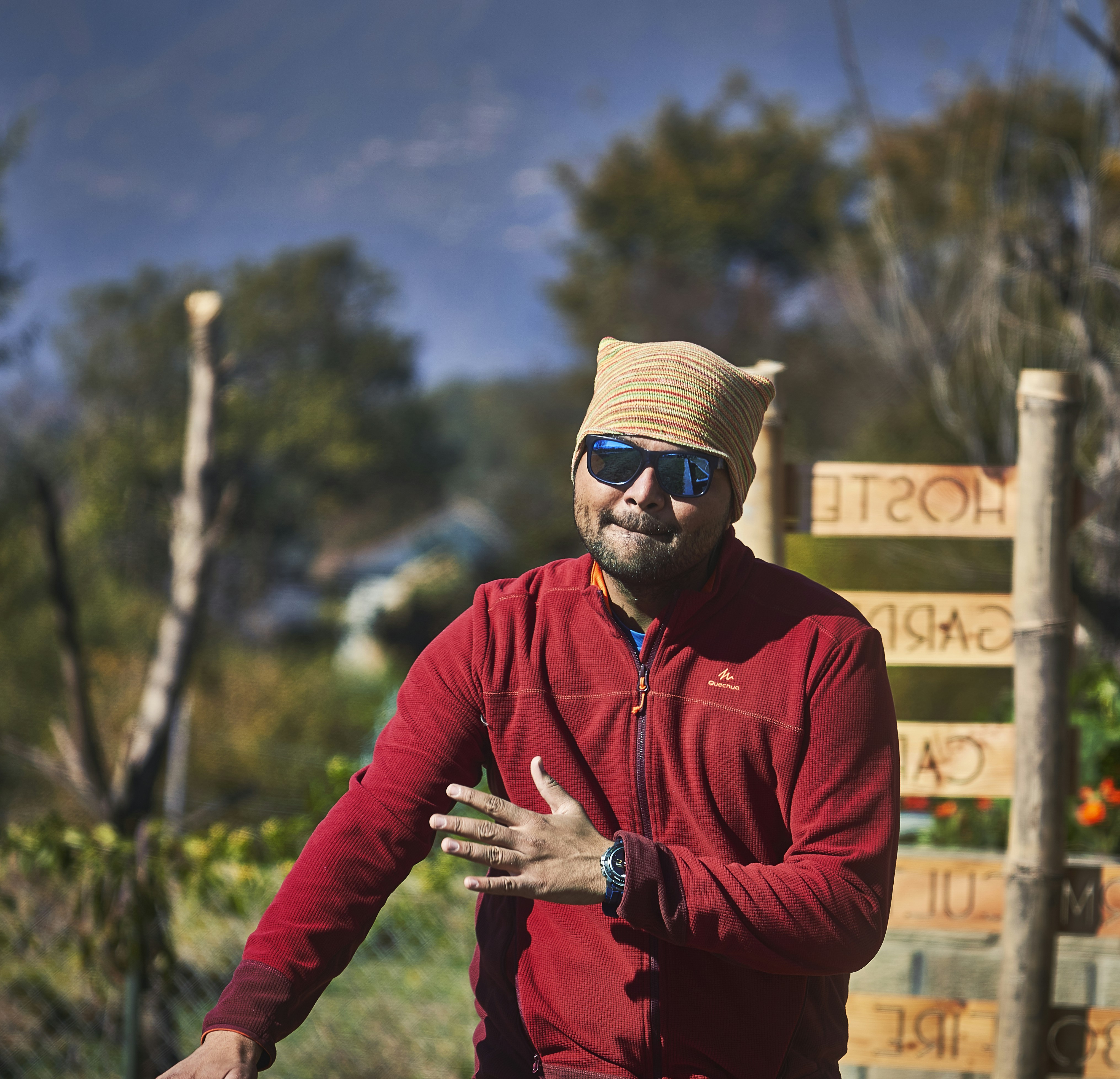 shallow focus photo of man in red full-zip jacket