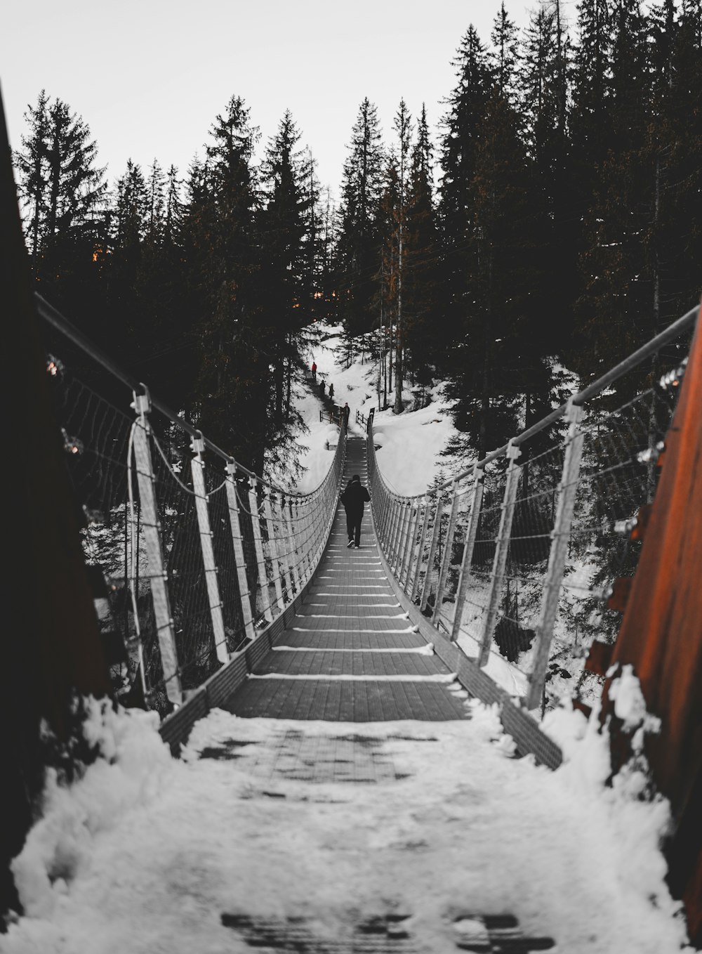 person walking on bridge during daytime