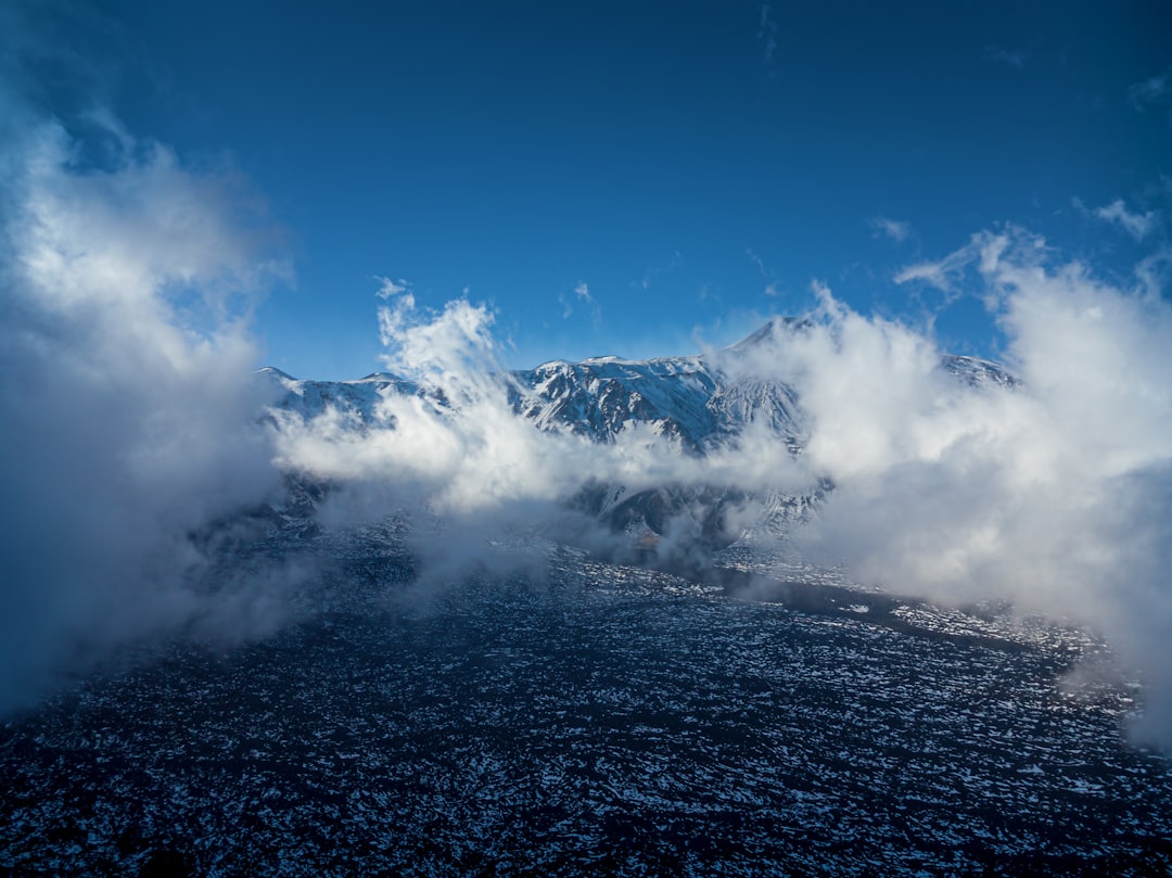 mountains near body of water