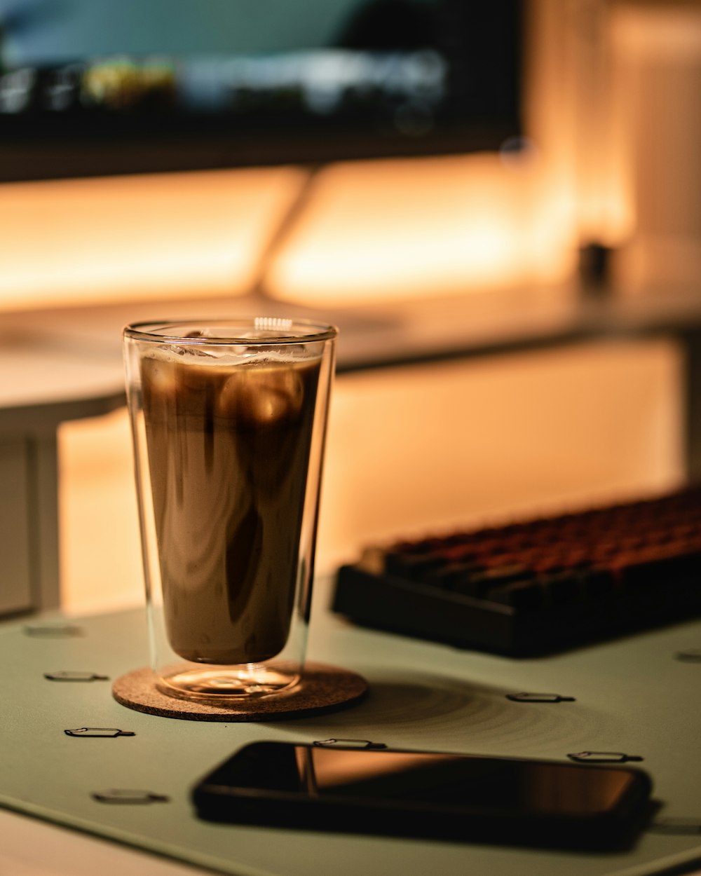 black liquid in clear drinking glass