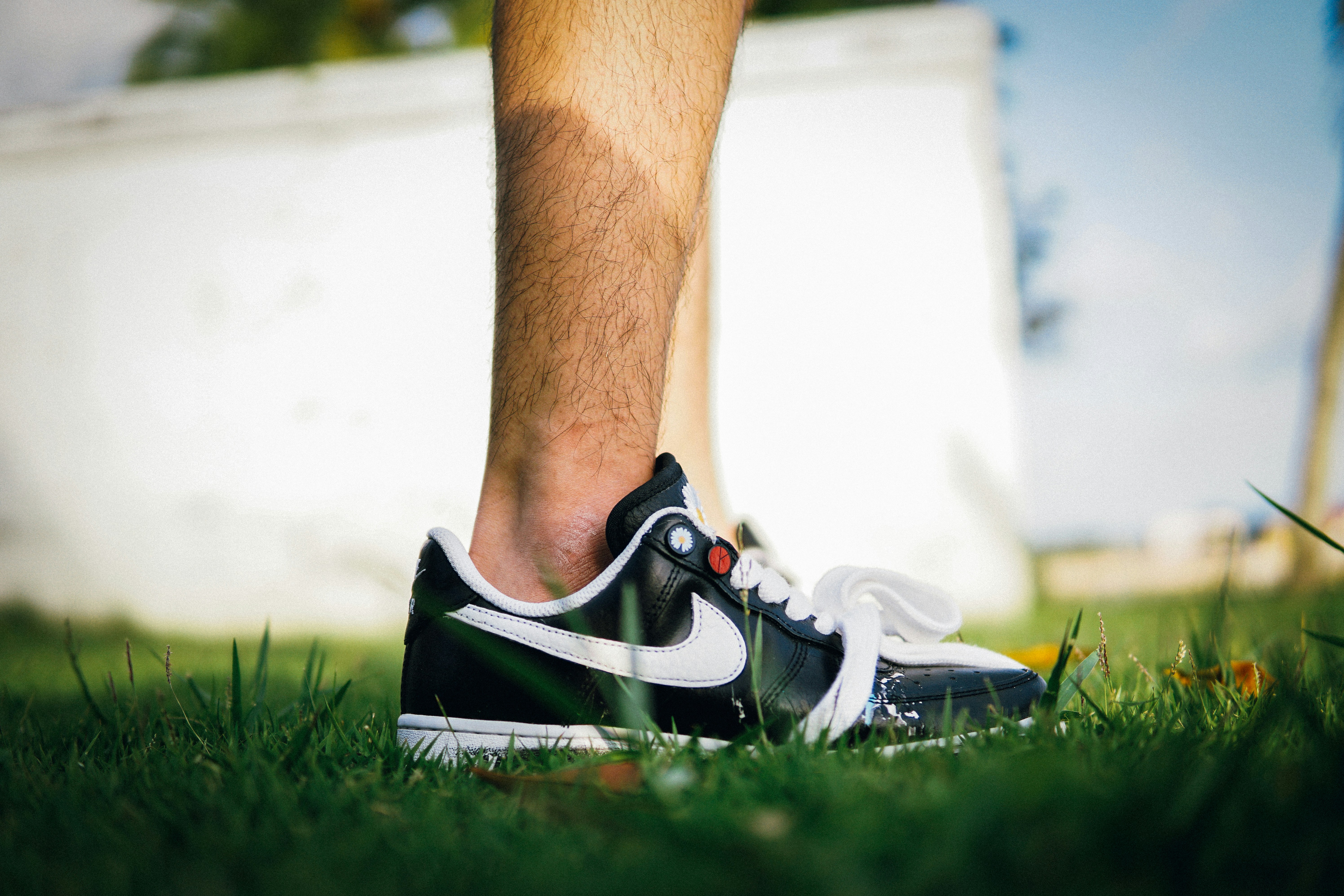 Person in white and black Nike lowtop sneaker photo Free Clothing