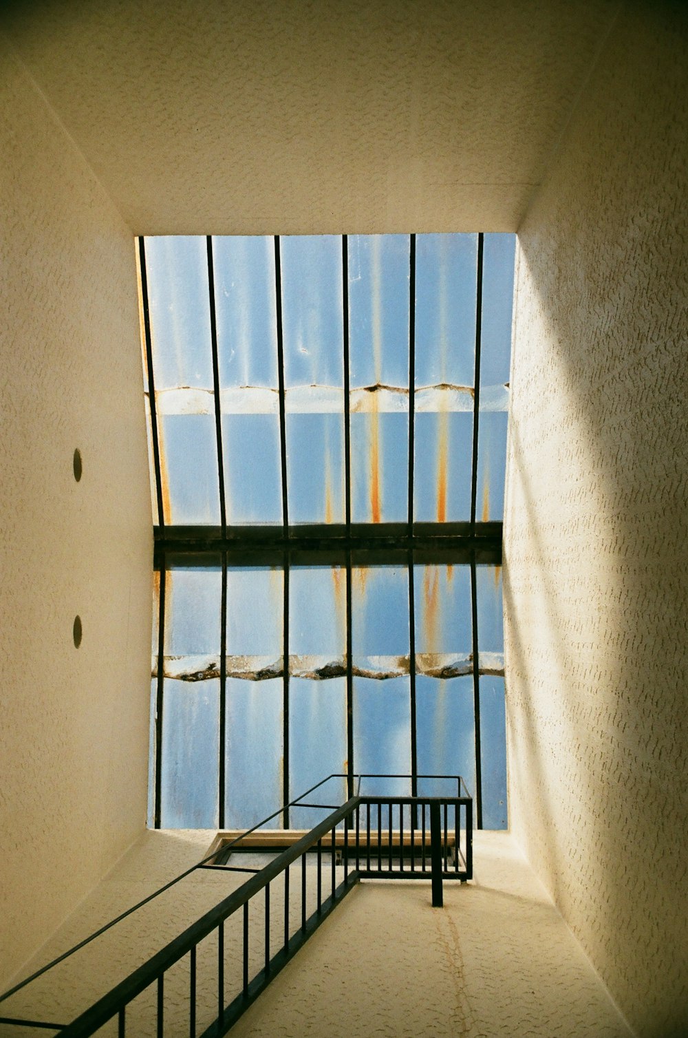 black metal stairs inside white building