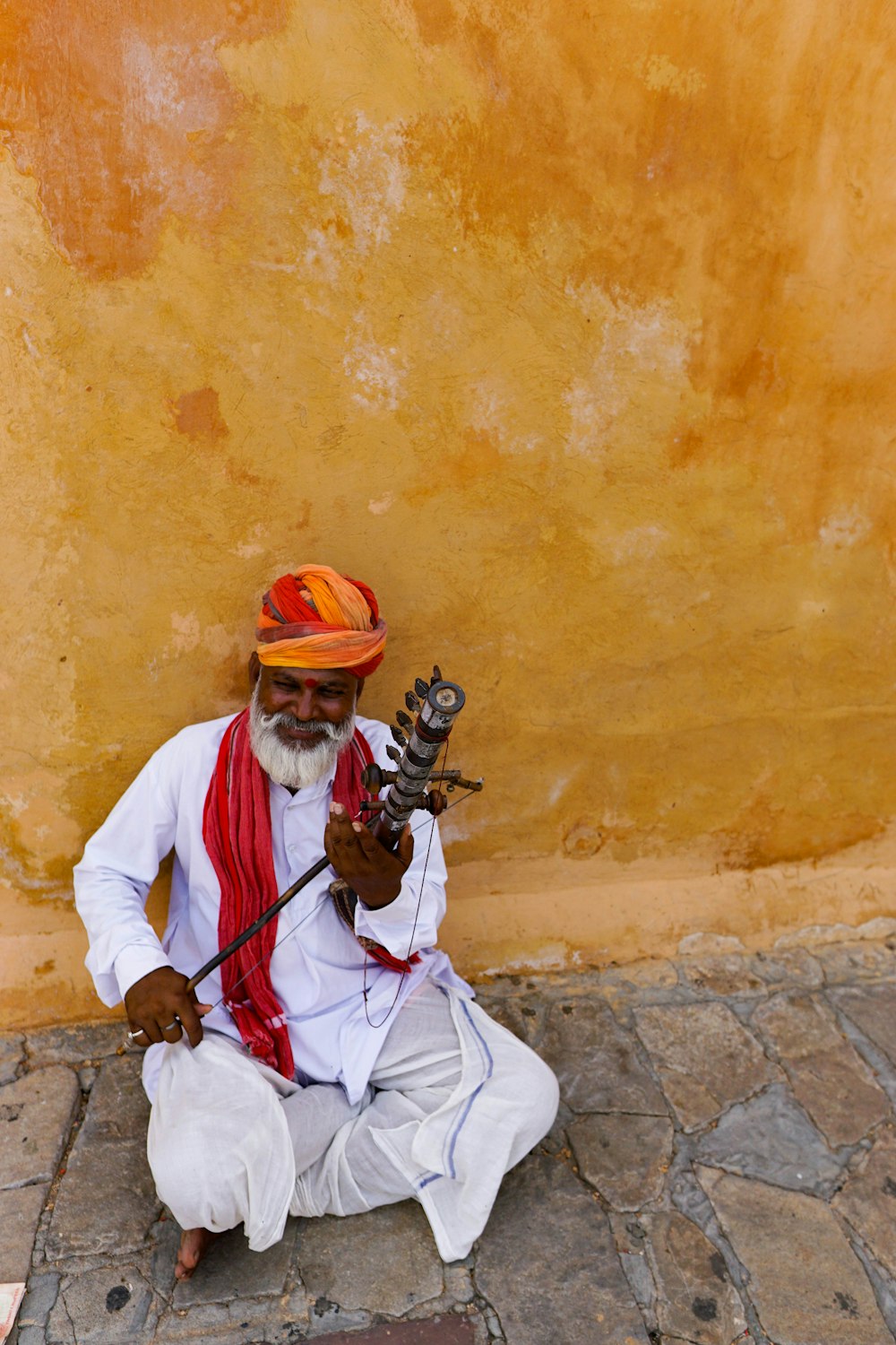 man playing instrument