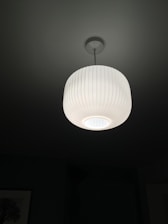 A sleek ambient lamp illuminating a modern living space.