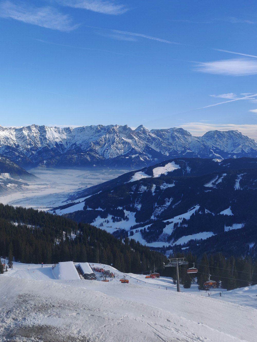 snow covered mountain under cloudy sky