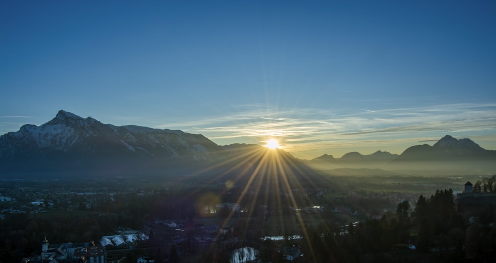 aerial photography of green mountains under a calm blue sky