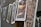 A series of photographs are hanging on a line, secured with wooden clothespins. The images feature various scenes, including landscapes and cityscapes, with vibrant colors and blurry effects. The angle of the shot provides a depth of field, focusing on the middle images while others are out of focus.