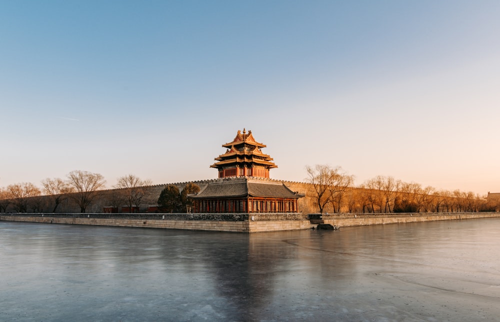 landscape photography of a pagoda under calm blue sky during daytime