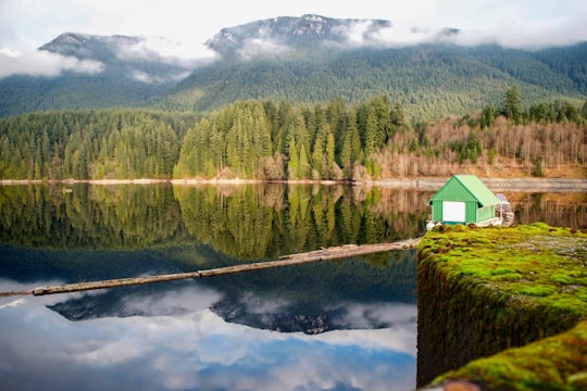 green house beside body of water in Capilano River Canada