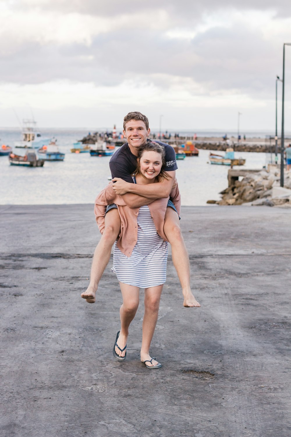 man piggy-backing on a woman