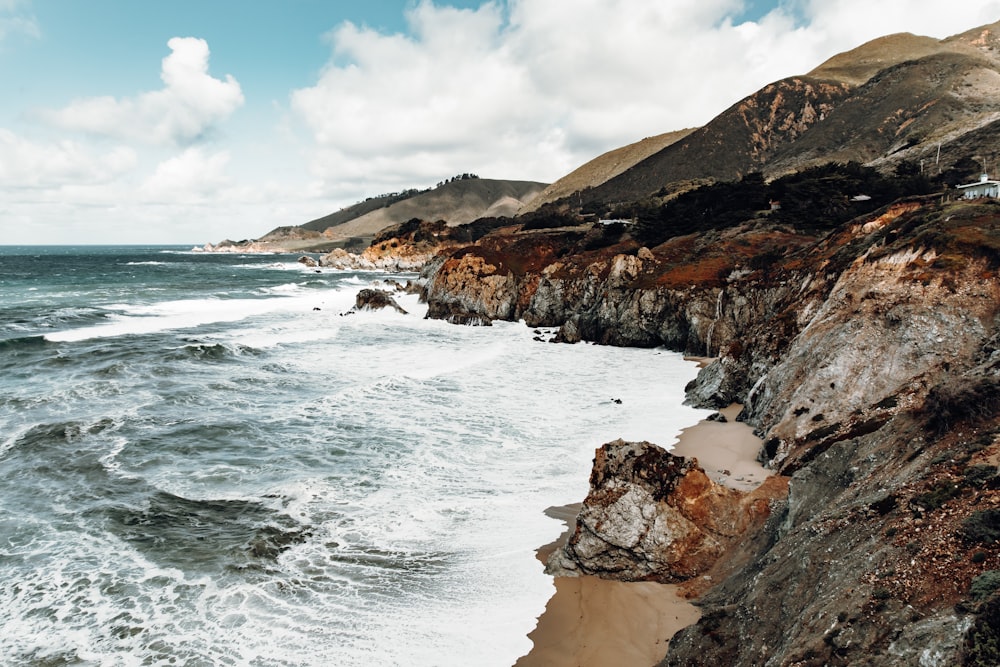 ocean under cloudy sky