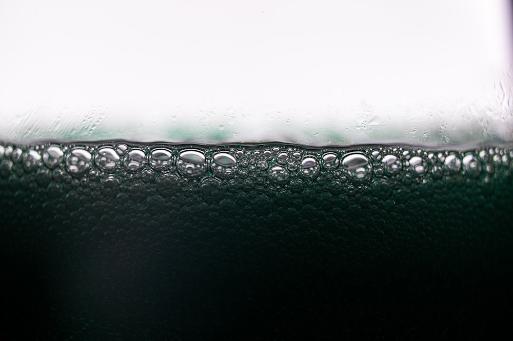 a close up of water droplets on a glass