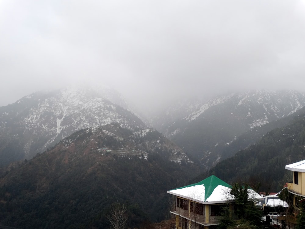 cabin on hill near mountain