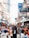 A vibrant street market bustling with local vendors and shoppers.