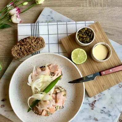 Freshly prepared Scandinavian-style dish on a rustic wooden table, bathed in natural light.