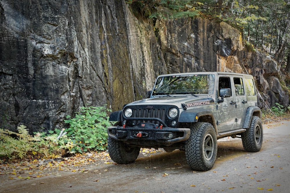 gray SUV passing by a rough road