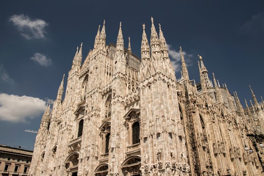 brown cathedral photograph in Duomo di Milano Italy