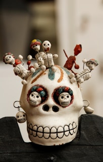 white and multicolored skull miniature