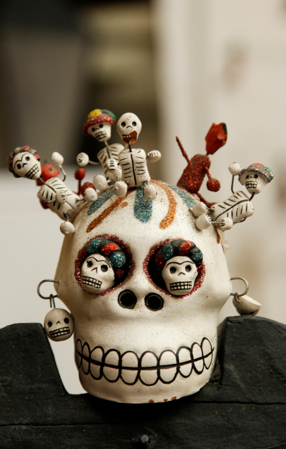white and multicolored skull miniature