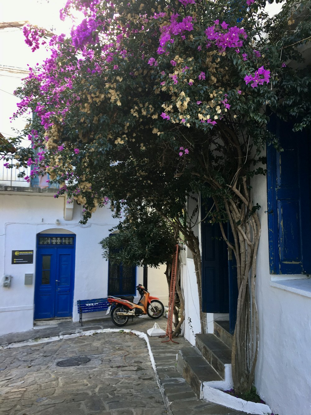 parked motorcycle beside building