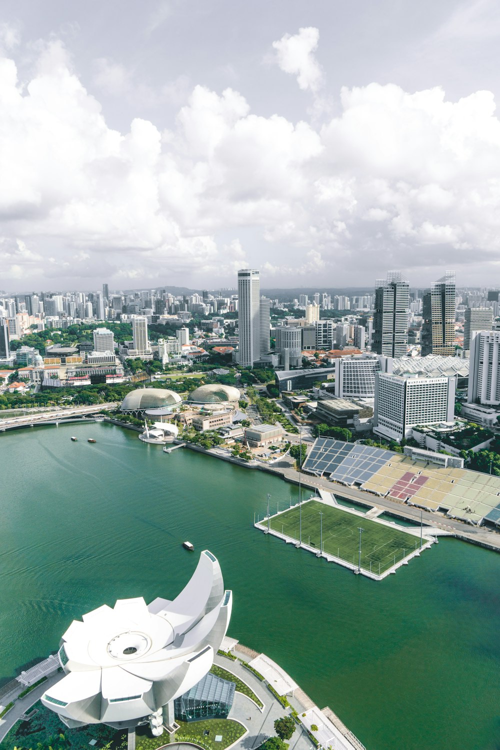 an aerial view of a city with a large body of water