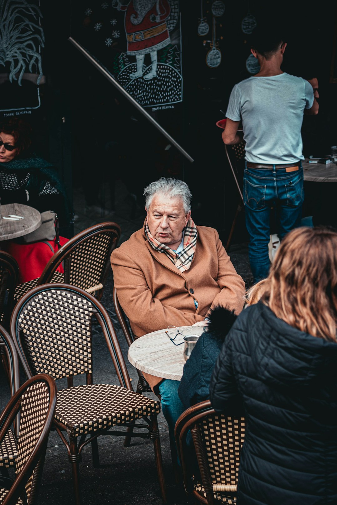 man and woman sitting around table