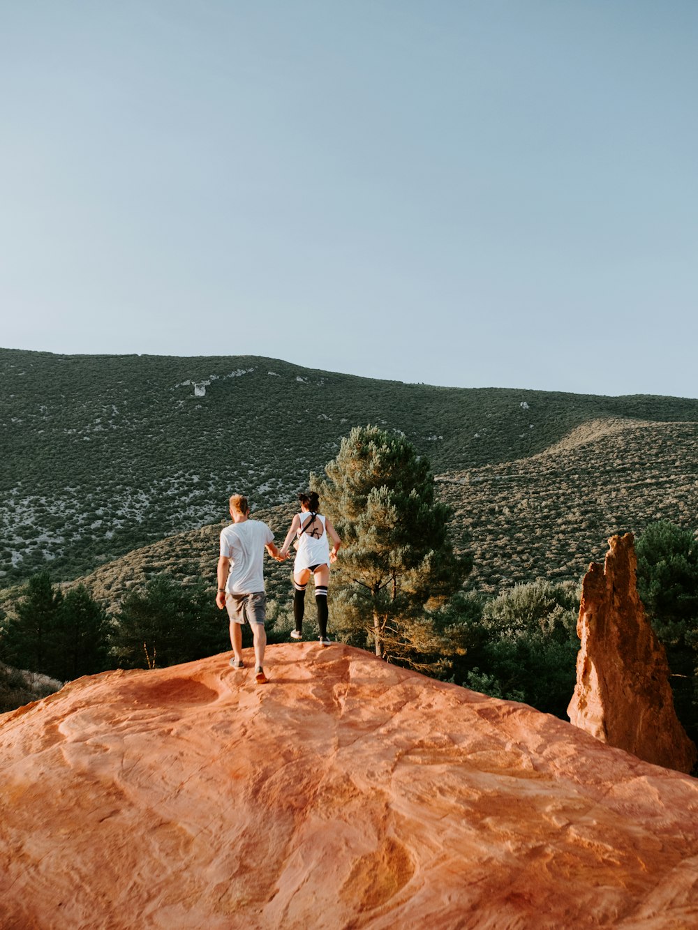 couple on rock formation