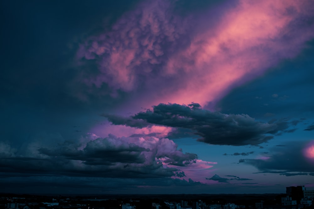 a purple and blue sky filled with clouds