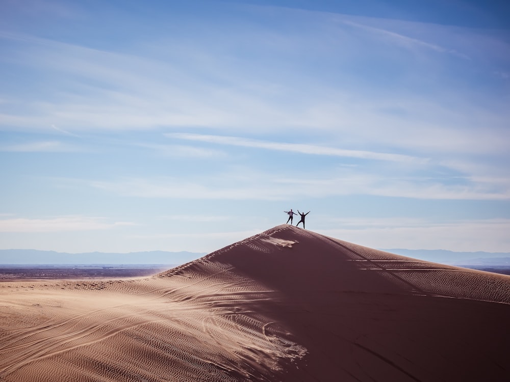 two persons on top of hill