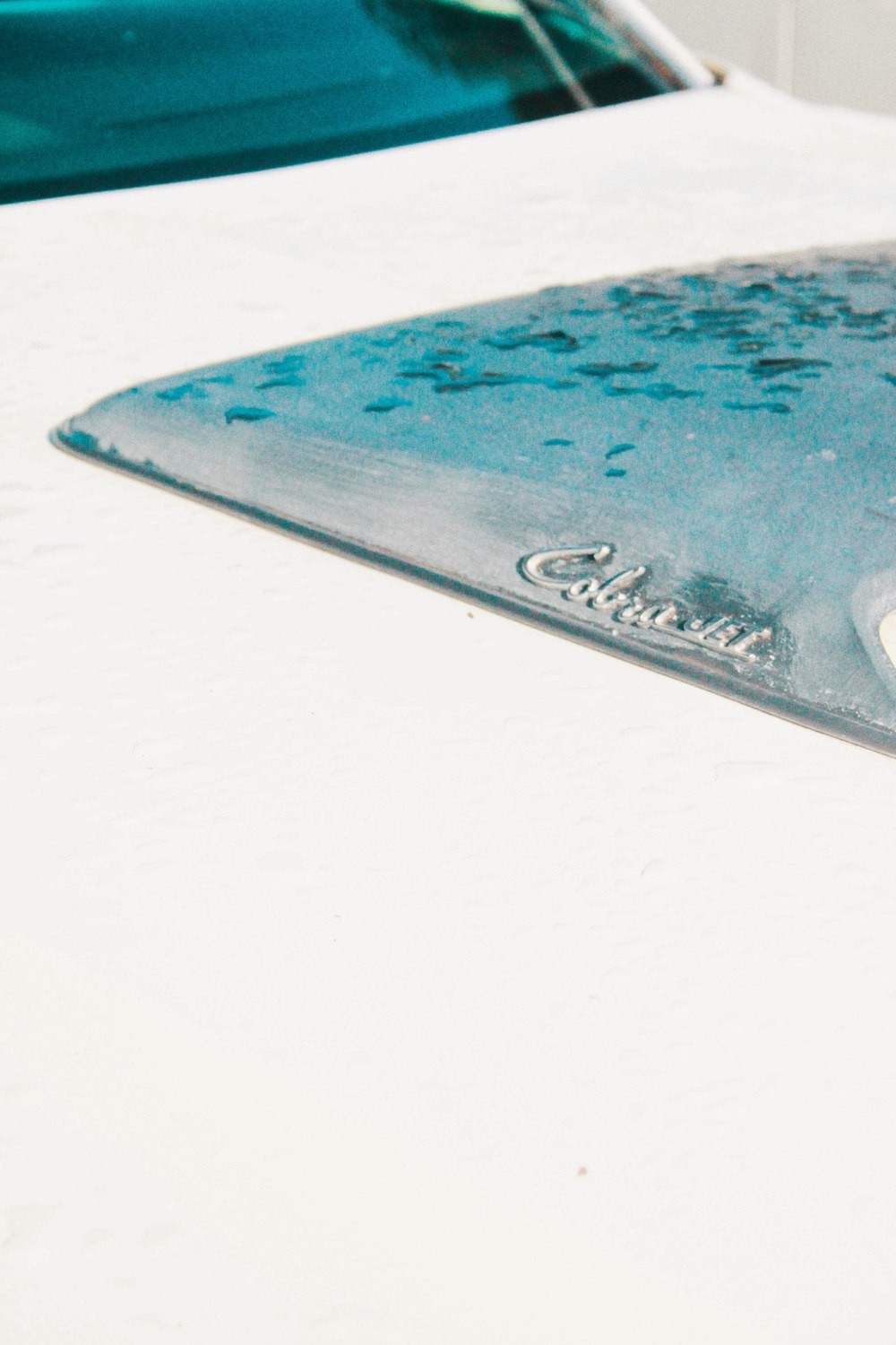 a close up of a surfboard on a white surfboard