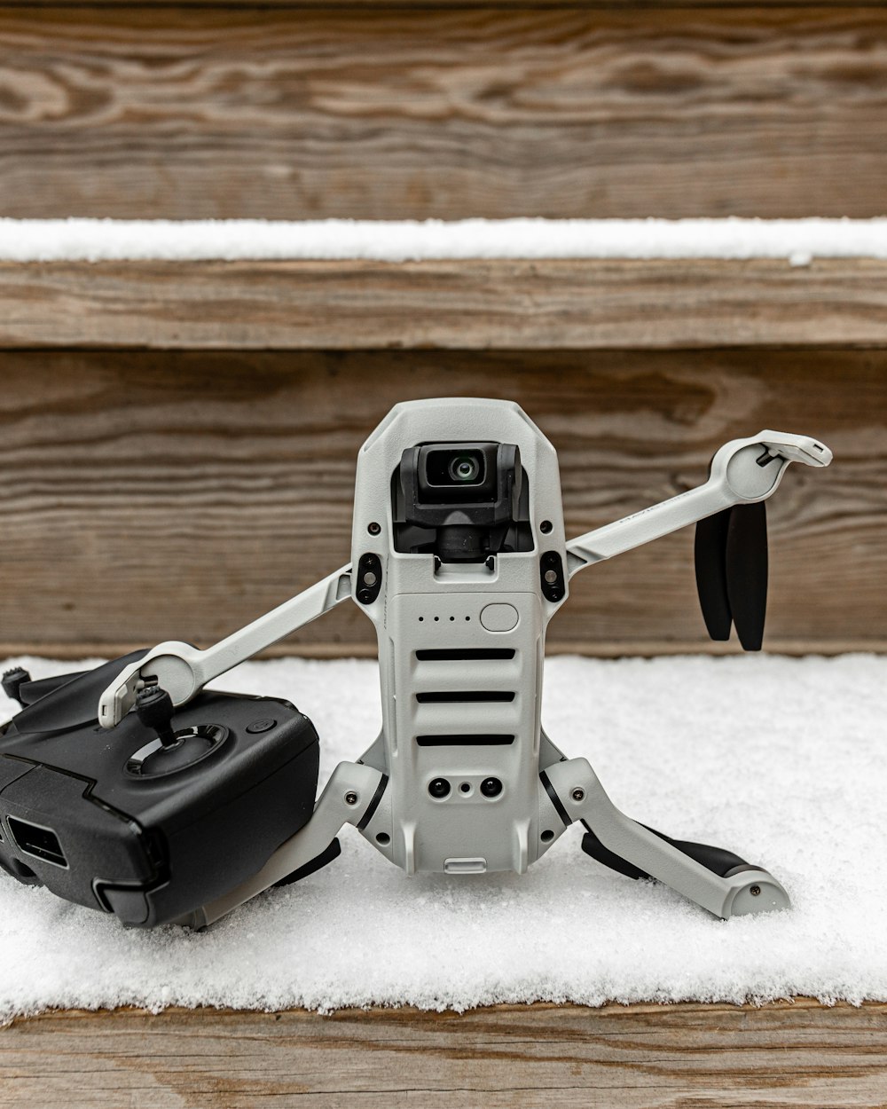 gray quadcopter drone on snow