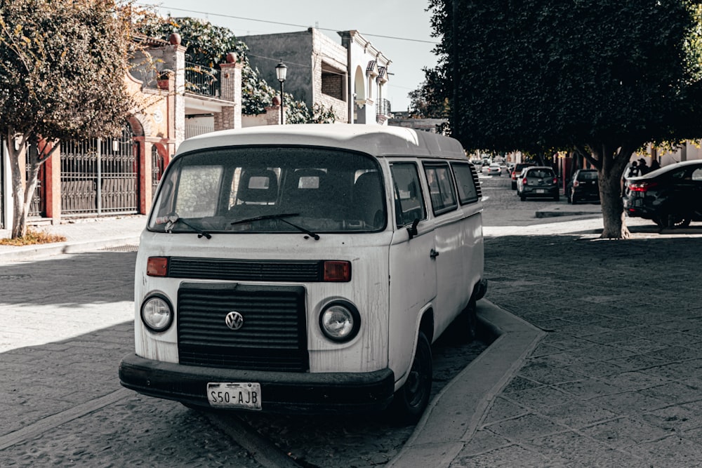 a white van parked on the side of a road