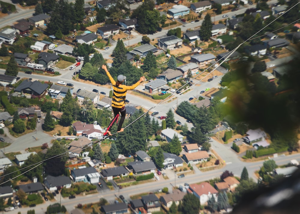 woman balancing on rope during day