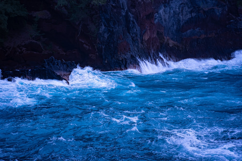 sea waves crashing through rocks