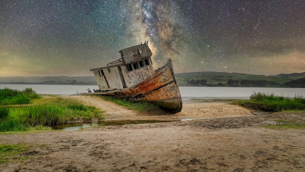 wrecked wooden boat on shore