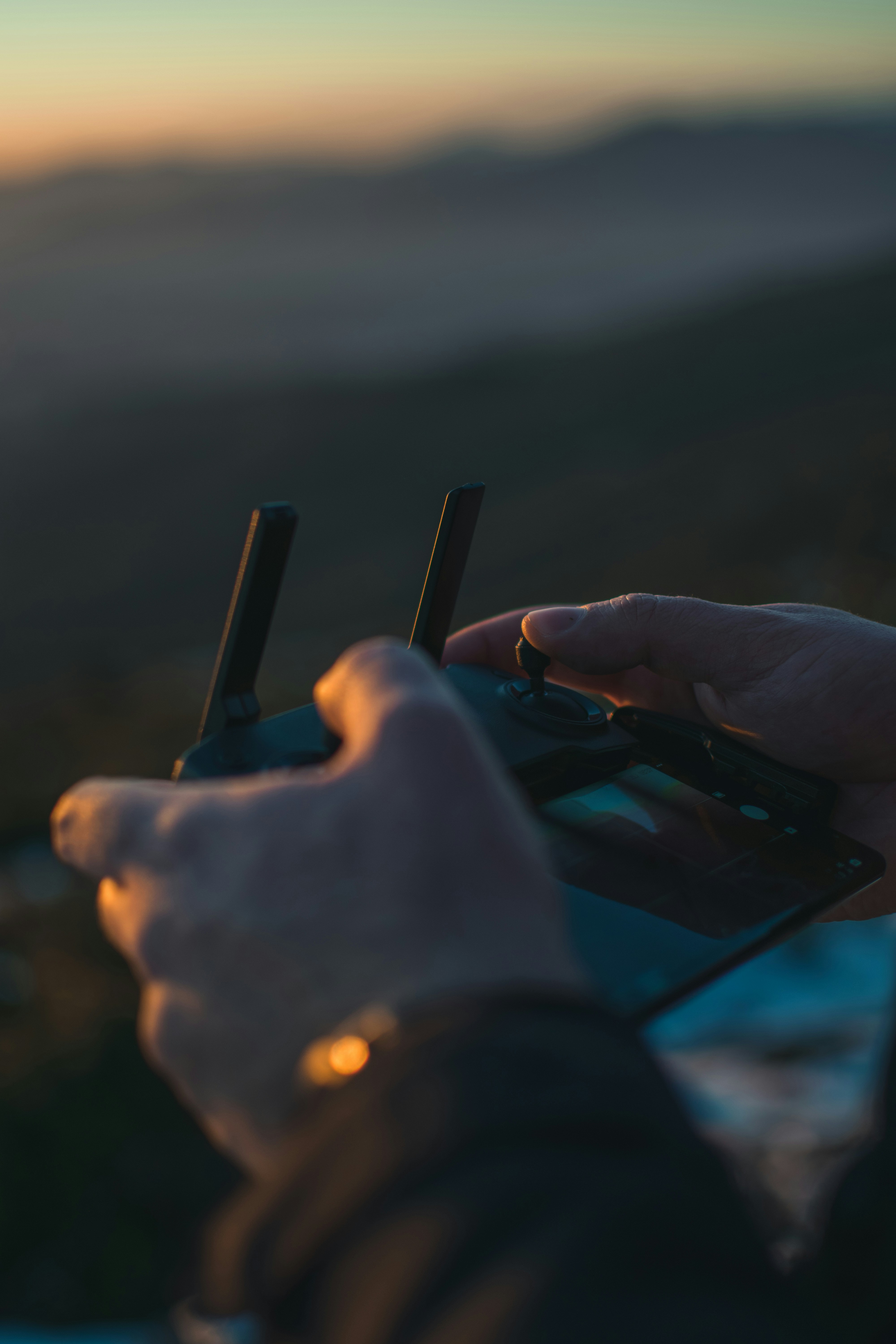 person holding black remote control
