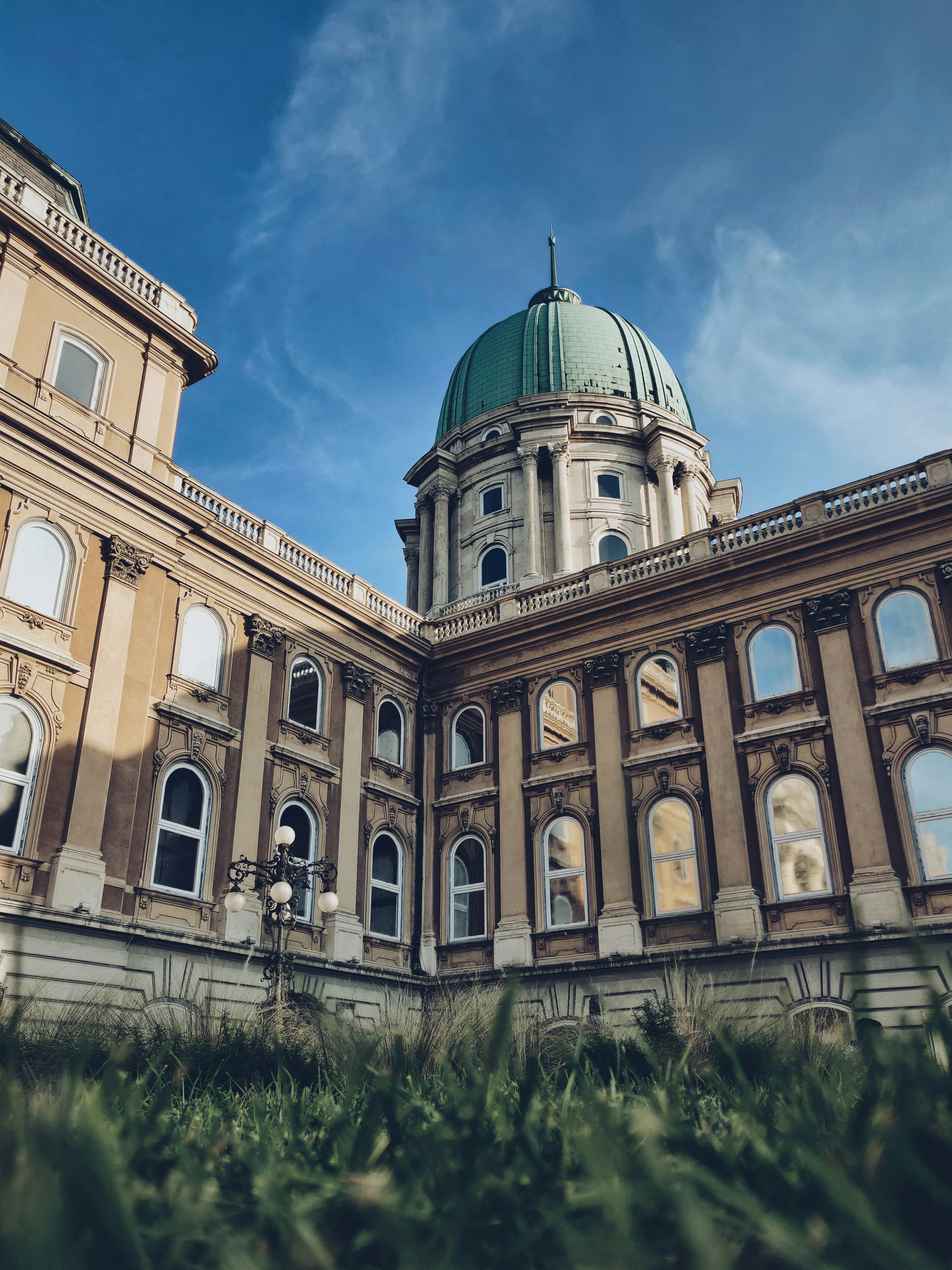low-angle photography of a blue and white dome cathedral under a calm blue sky