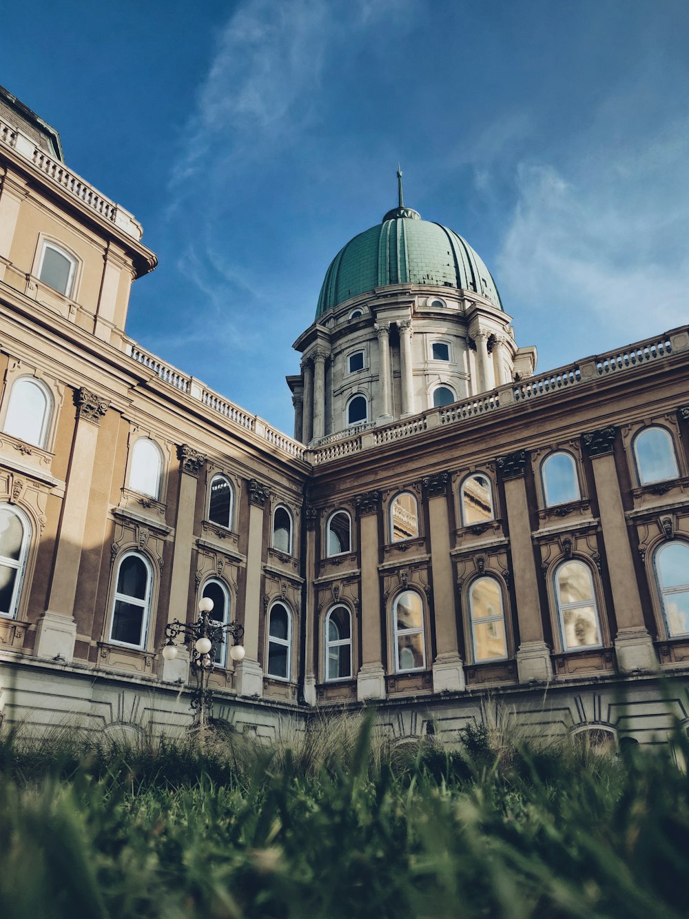 low-angle photography of a blue and white dome cathedral under a calm blue sky